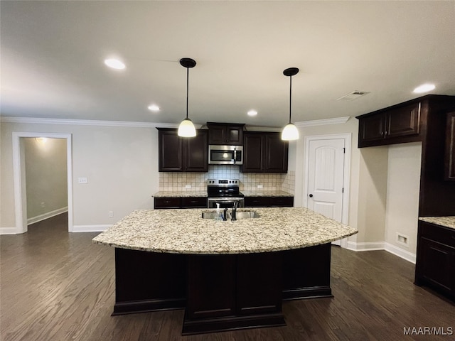 kitchen featuring a sink, crown molding, backsplash, baseboards, and appliances with stainless steel finishes