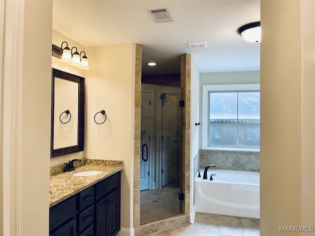 full bath with visible vents, vanity, a bath, and a stall shower