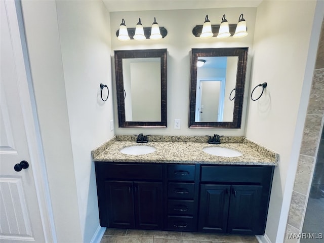 bathroom with double vanity and a sink