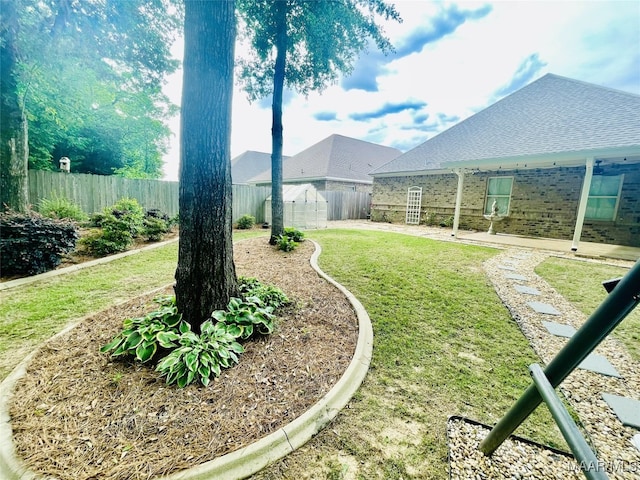 view of yard featuring a patio and a fenced backyard
