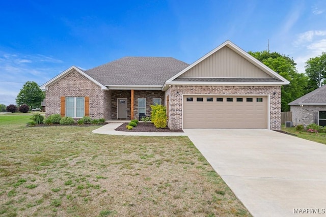 view of front facade featuring brick siding, a front lawn, an attached garage, and driveway