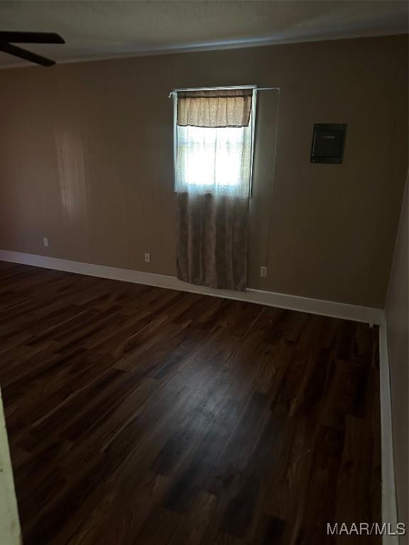 222 Woodbine St, Selma, AL 36701 - unfurnished room featuring ceiling fan, dark wood-type flooring, baseboards, and crown molding
