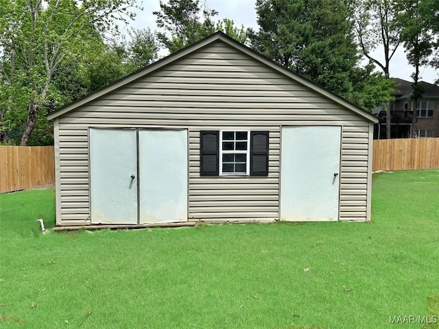 view of outbuilding featuring a fenced backyard and an outbuilding
