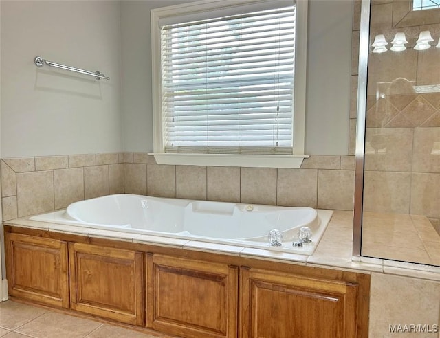 full bathroom with tile patterned flooring and a bath