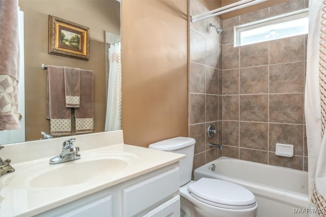bathroom with vanity, shower / bath combo, and toilet