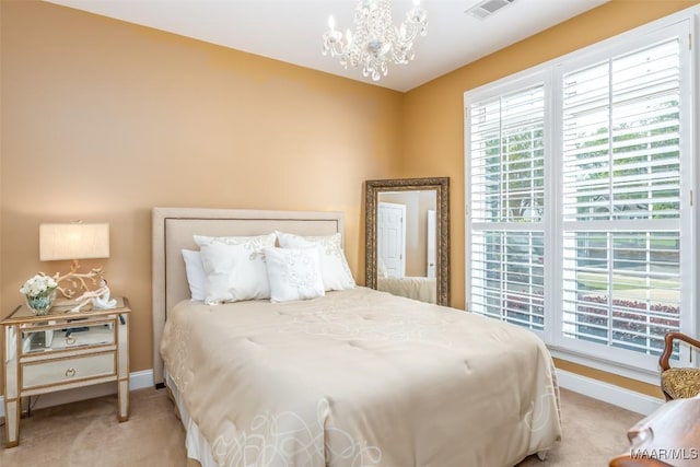 carpeted bedroom featuring baseboards, a chandelier, multiple windows, and visible vents