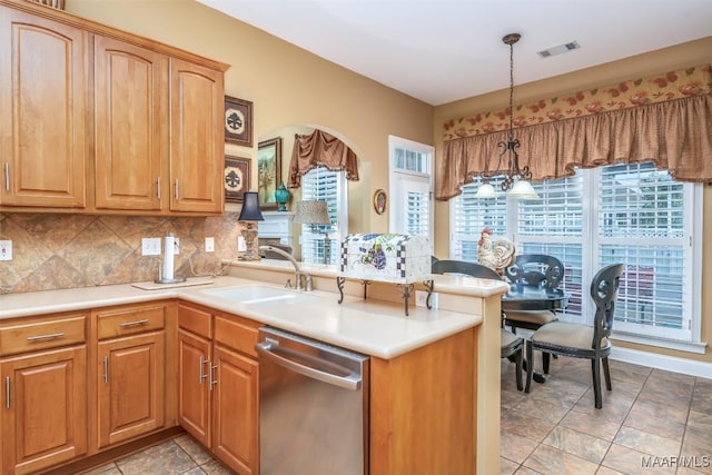 kitchen with backsplash, visible vents, pendant lighting, dishwasher, and a peninsula