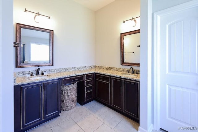 full bath featuring a sink, tile patterned floors, and double vanity