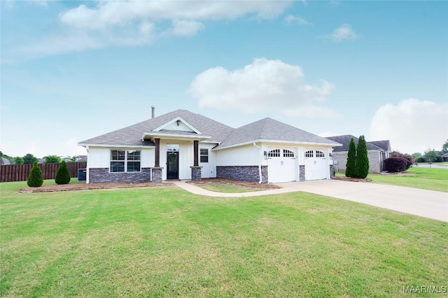 view of front facade with a garage, fence, a front lawn, concrete driveway, and stone siding