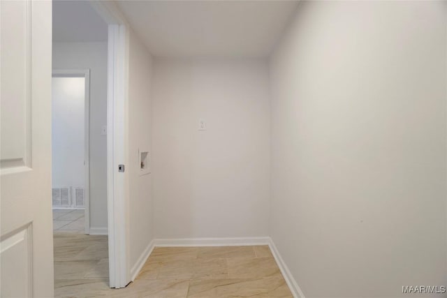 corridor with baseboards and visible vents
