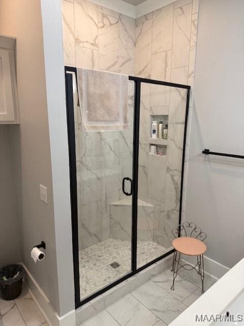 169 Foxfire Ct, Wetumpka, AL 36092 - bathroom featuring baseboards, marble finish floor, and a marble finish shower
