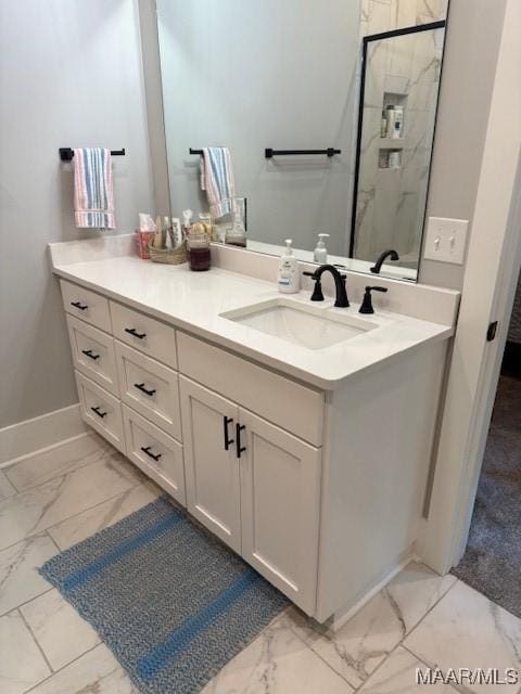 169 Foxfire Ct, Wetumpka, AL 36092 - bathroom with vanity, baseboards, marble finish floor, and a stall shower
