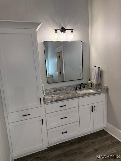169 Foxfire Ct, Wetumpka, AL 36092 - bathroom with baseboards, a sink, wood finished floors, and double vanity
