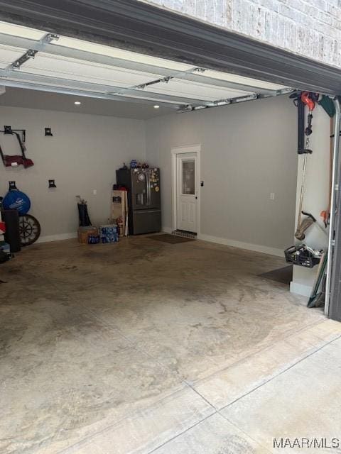 169 Foxfire Ct, Wetumpka, AL 36092 - garage with refrigerator and baseboards