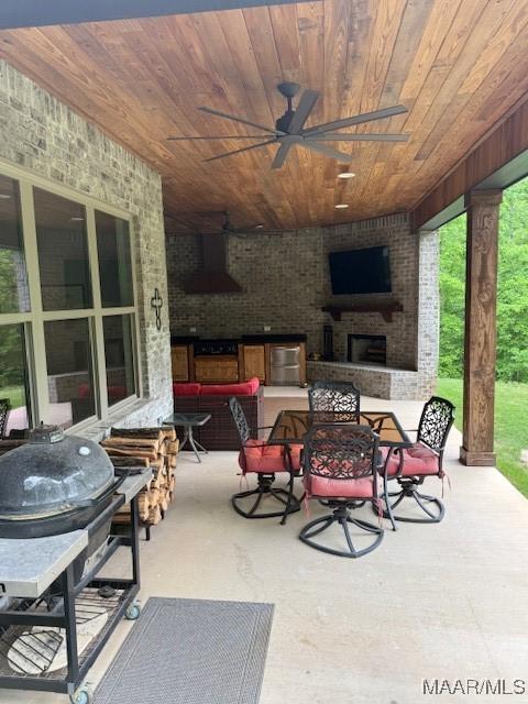 169 Foxfire Ct, Wetumpka, AL 36092 - view of patio featuring ceiling fan, grilling area, and an outdoor brick fireplace
