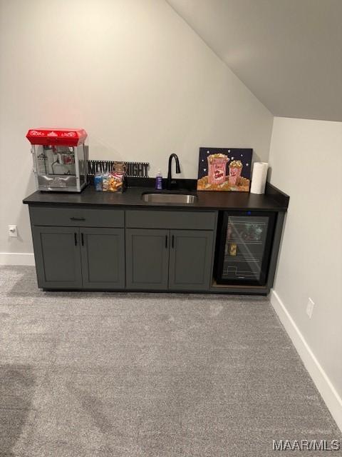 169 Foxfire Ct, Wetumpka, AL 36092 - bar with light colored carpet, a sink, baseboards, lofted ceiling, and bar area