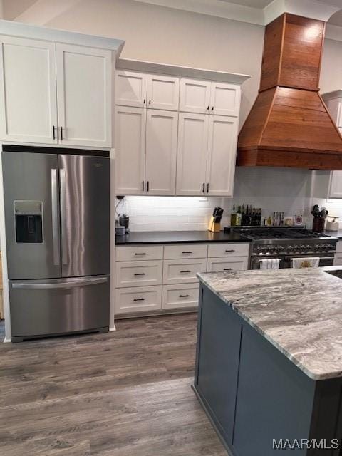 169 Foxfire Ct, Wetumpka, AL 36092 - kitchen featuring white cabinets, stainless steel fridge, premium range hood, dark wood-type flooring, and gas range oven