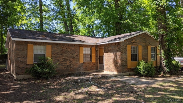 single story home with brick siding