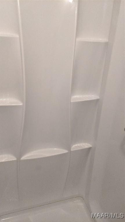 full bath featuring walk in shower