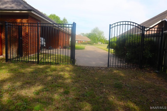 view of gate with fence
