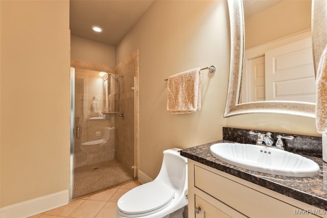 105 Bell Pkwy, Wetumpka, AL 36092 - full bathroom featuring tile patterned flooring, vanity, toilet, baseboards, and a stall shower