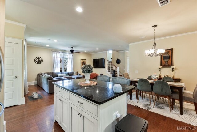 105 Bell Pkwy, Wetumpka, AL 36092 - kitchen with visible vents, ornamental molding, dark wood-style flooring, open floor plan, and white cabinets