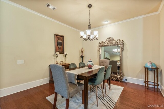 105 Bell Pkwy, Wetumpka, AL 36092 - dining room with visible vents, ornamental molding, wood finished floors, and a notable chandelier