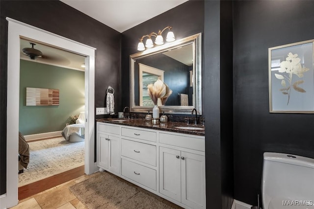 105 Bell Pkwy, Wetumpka, AL 36092 - bathroom with double vanity, a sink, connected bathroom, and toilet