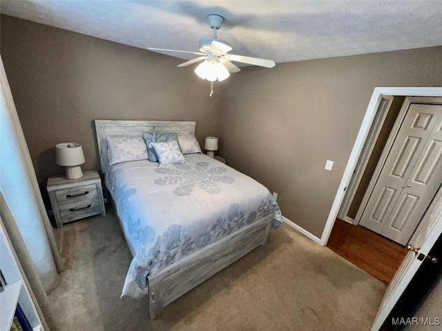 bedroom with baseboards, carpet flooring, and ceiling fan