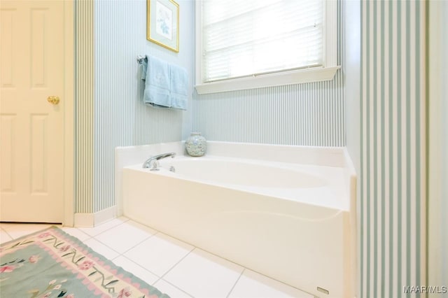 full bathroom with baseboards, a bath, tile patterned floors, and wallpapered walls