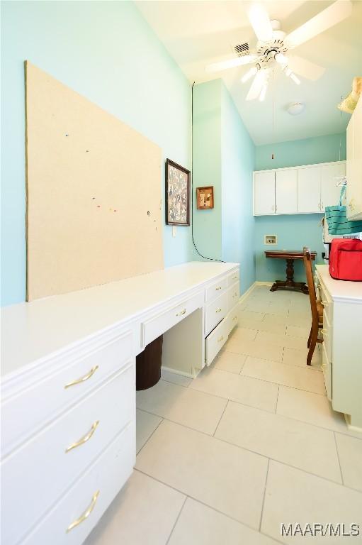 washroom with light tile patterned floors, baseboards, ceiling fan, and visible vents