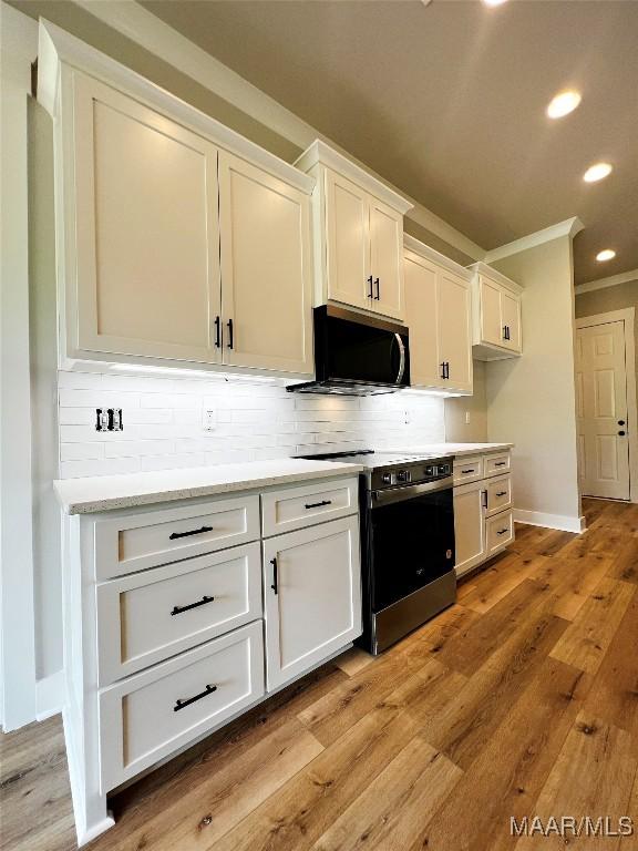 171 Mountain Laurel Rdg, Wetumpka, AL 36093 - kitchen with stainless steel appliances, crown molding, decorative backsplash, baseboards, and recessed lighting