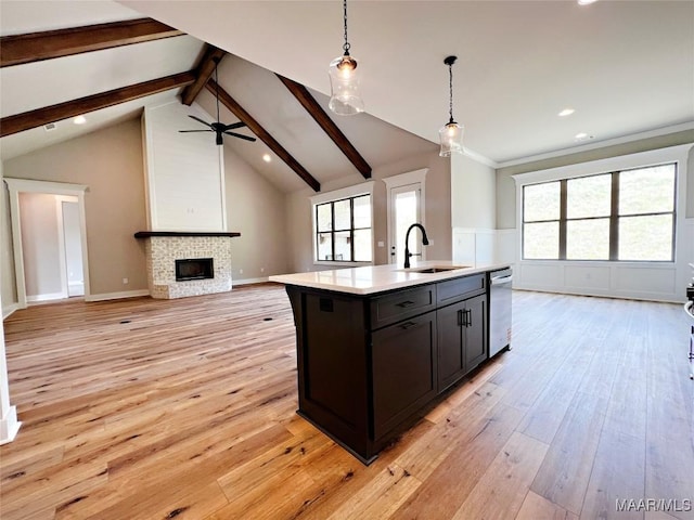 171 Mountain Laurel Rdg, Wetumpka, AL 36093 - kitchen featuring open floor plan, a sink, dishwasher, beamed ceiling, and light countertops