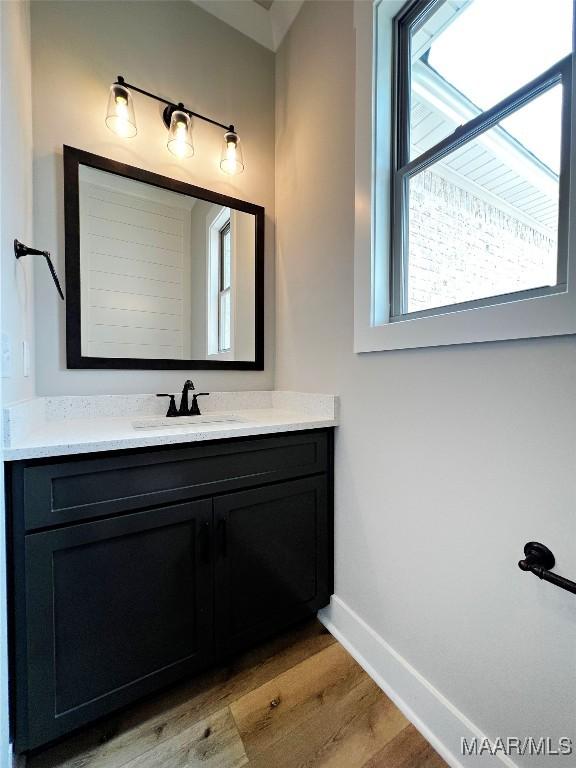 171 Mountain Laurel Rdg, Wetumpka, AL 36093 - bathroom with wood finished floors, baseboards, and vanity