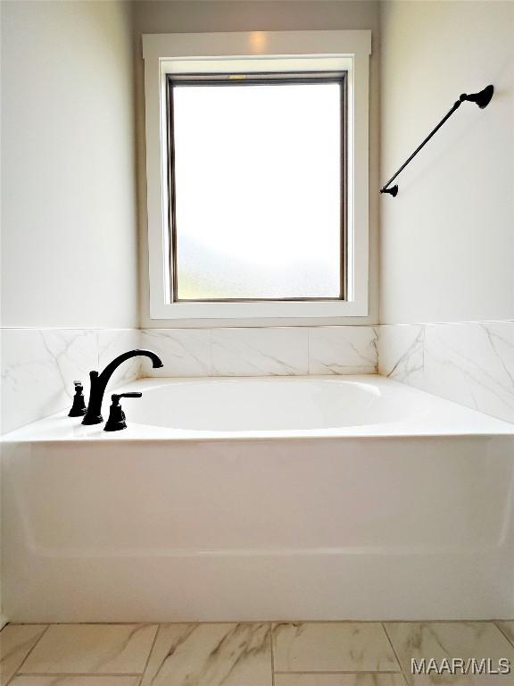 171 Mountain Laurel Rdg, Wetumpka, AL 36093 - full bathroom featuring a garden tub and marble look tiles