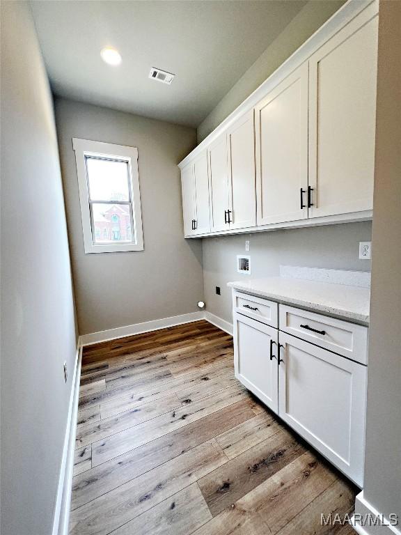 171 Mountain Laurel Rdg, Wetumpka, AL 36093 - laundry area with cabinet space, hookup for a washing machine, baseboards, light wood finished floors, and recessed lighting