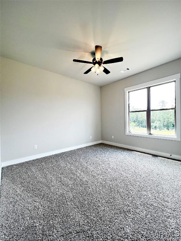 171 Mountain Laurel Rdg, Wetumpka, AL 36093 - spare room with baseboards, carpet floors, and ceiling fan