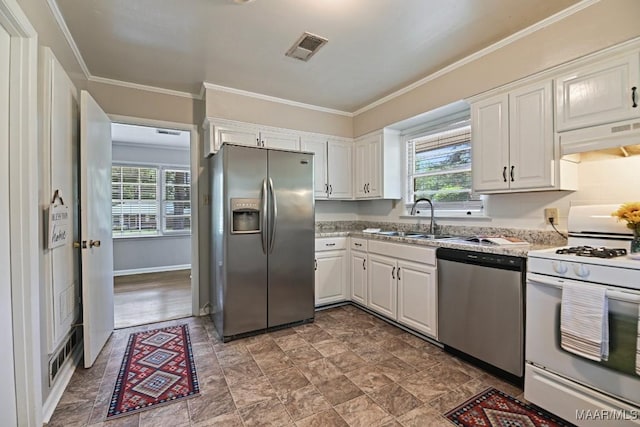kitchen featuring appliances with stainless steel finishes, a healthy amount of sunlight, a sink, and visible vents
