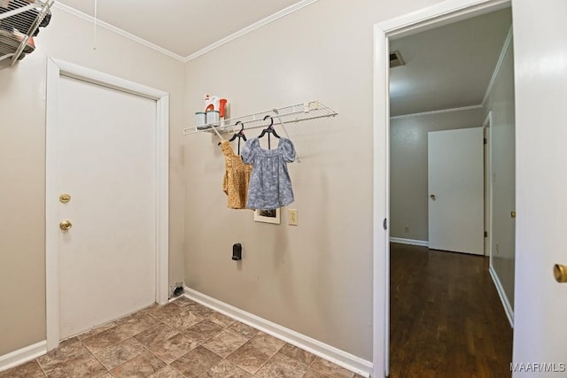 laundry room with crown molding, baseboards, attic access, and washer hookup