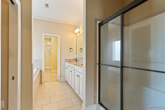 bathroom featuring crown molding, a walk in closet, tile patterned flooring, vanity, and a shower with door