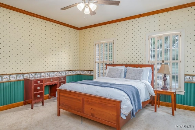 bedroom featuring carpet floors, ornamental molding, ceiling fan, and wallpapered walls
