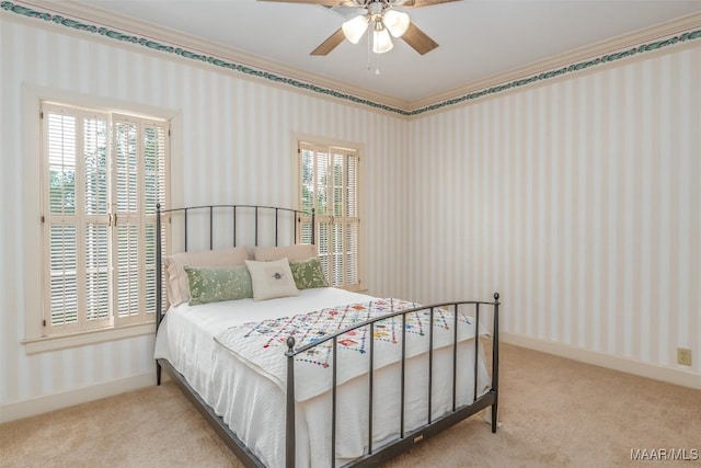 carpeted bedroom featuring ceiling fan, wallpapered walls, and baseboards