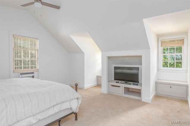 bedroom with baseboards, ceiling fan, light carpet, and lofted ceiling