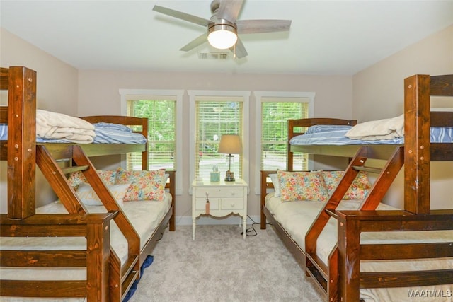 bedroom with baseboards, carpet flooring, and visible vents