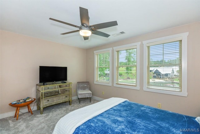 bedroom featuring baseboards, visible vents, ceiling fan, and carpet