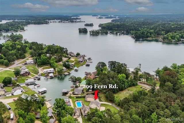 birds eye view of property featuring a water view and a forest view