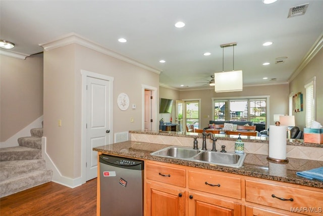 kitchen with stainless steel dishwasher, a sink, open floor plan, and ornamental molding