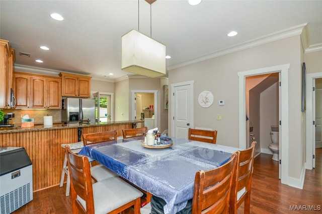 dining area featuring recessed lighting, ornamental molding, dark wood-type flooring, and visible vents