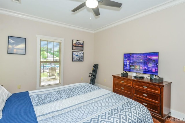 bedroom with crown molding, baseboards, ceiling fan, and visible vents