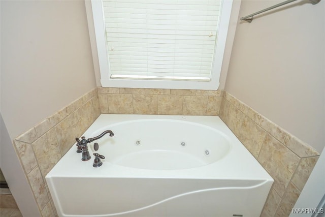 full bathroom featuring a tub with jets